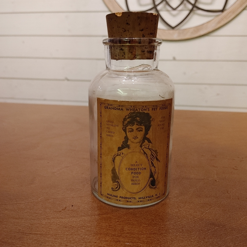 Vintage bird food bottle